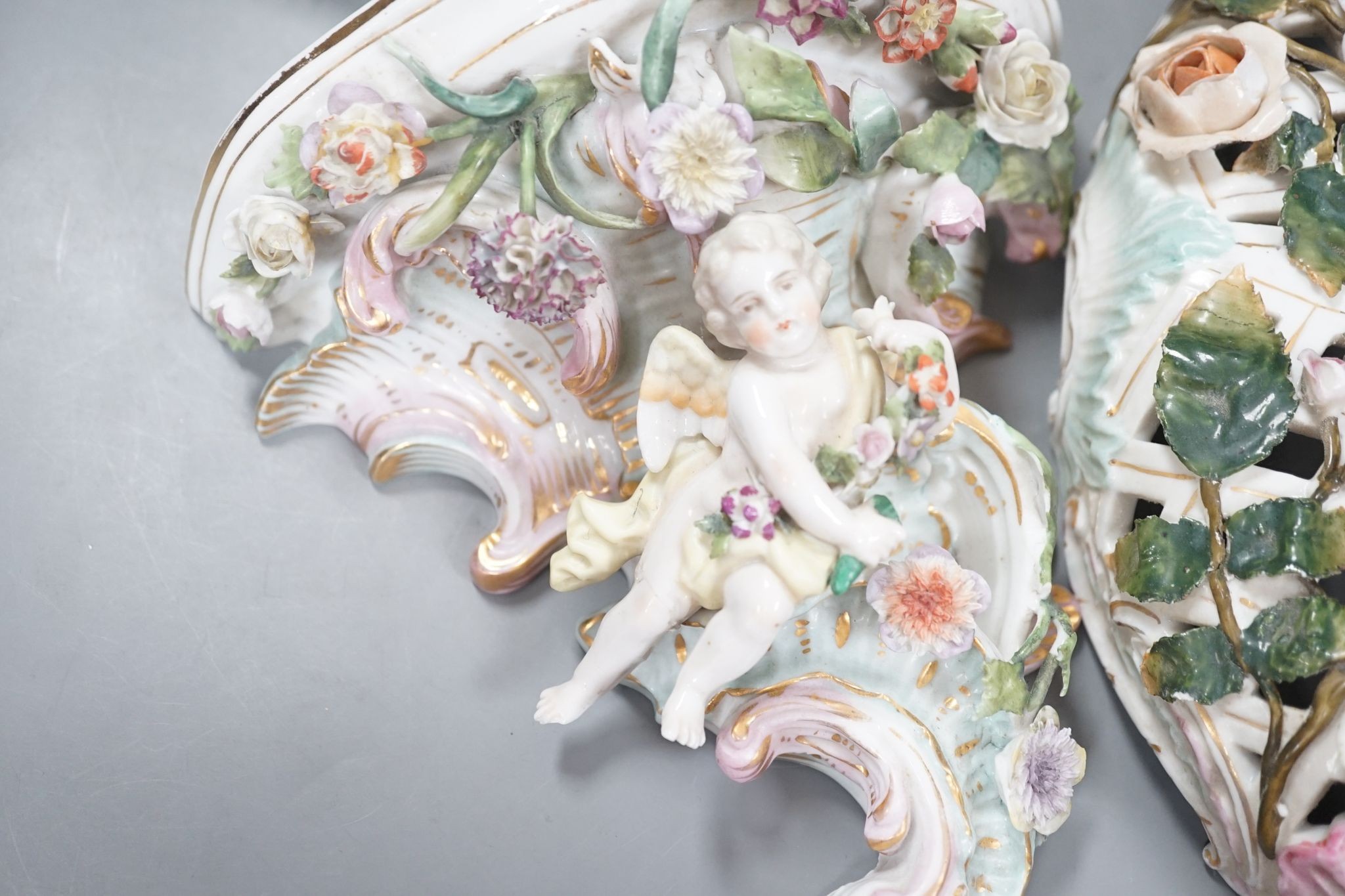 Two Sitzendorf porcelain ceiling shades, a similar wall bracket and a Dresden white glazed wall bracket, shades 30cm diameter